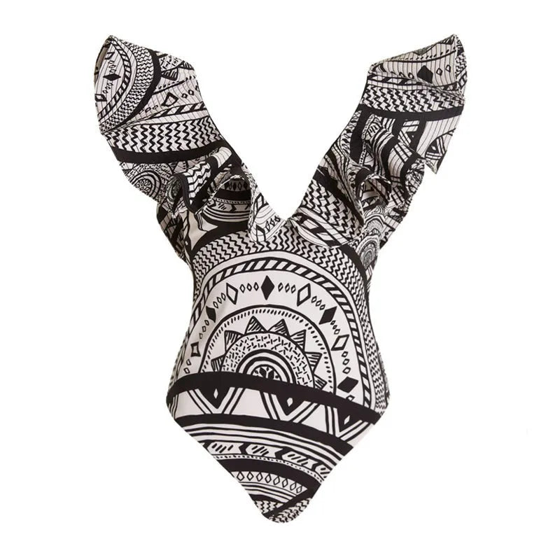 Women's vintage printed one-piece swimsuit with deep V neckline and ruffles, shown with matching wrap skirt.