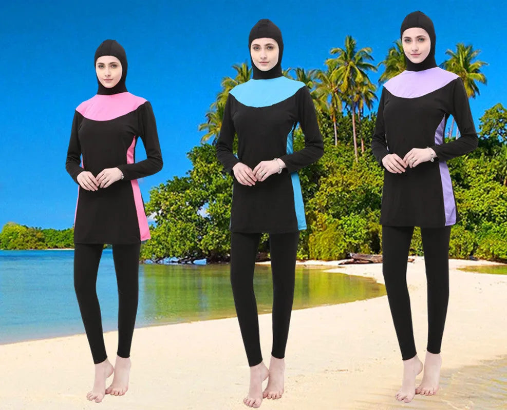 Black women's hooded long sleeve swimsuit with matching pants, shown in conservative one-piece style.