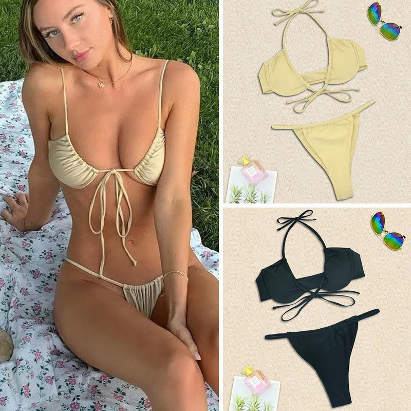 Women's black and mint green two-piece nylon bikini swimsuit on a white background.