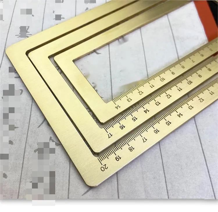 Solid brass square calligraphy paper weight with hand engraved surface on desk