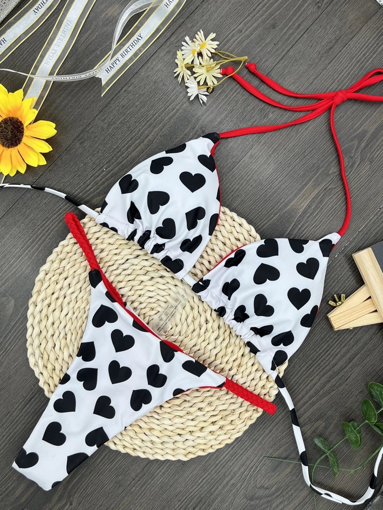 Backless one-piece swimsuit with a heart print and split side detail