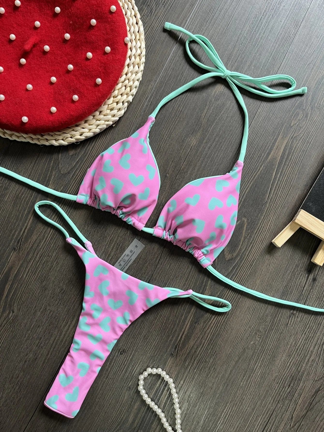 Backless one-piece swimsuit with a heart print and split side detail