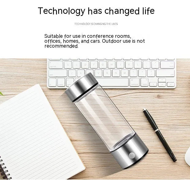 Hydrogen water bottle in silver with electric base, borosilicate glass body, 21.5cm tall, 401-500ml capacity