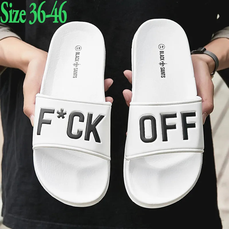Men's black open-toe slippers with a rubber sole, shown from the side.
