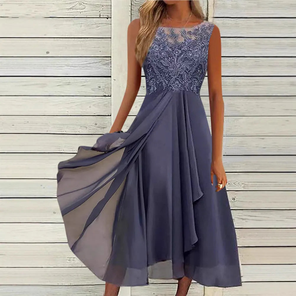 Women's sleeveless green chiffon dress with lace detailing and a mid-length skirt.