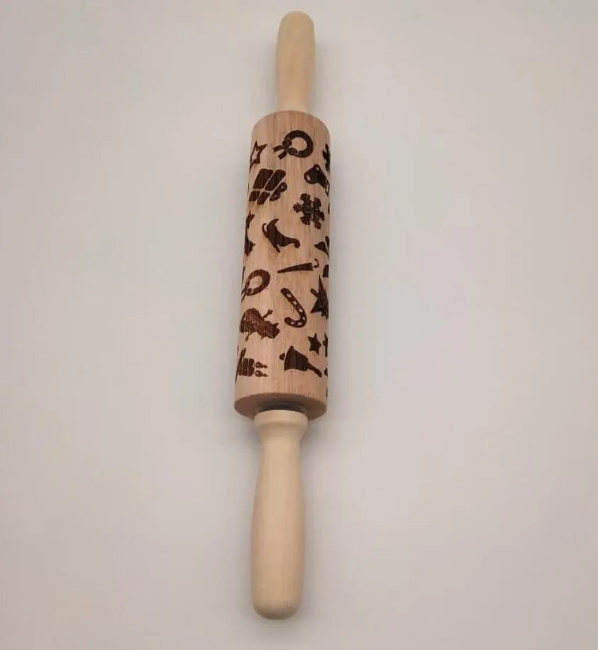 Natural wooden rolling pin with Christmas embossing patterns, 45 cm length, on a light background