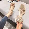 Women's white thick-heel Roman sandals with an 8cm chunky heel and sleeve-on design.