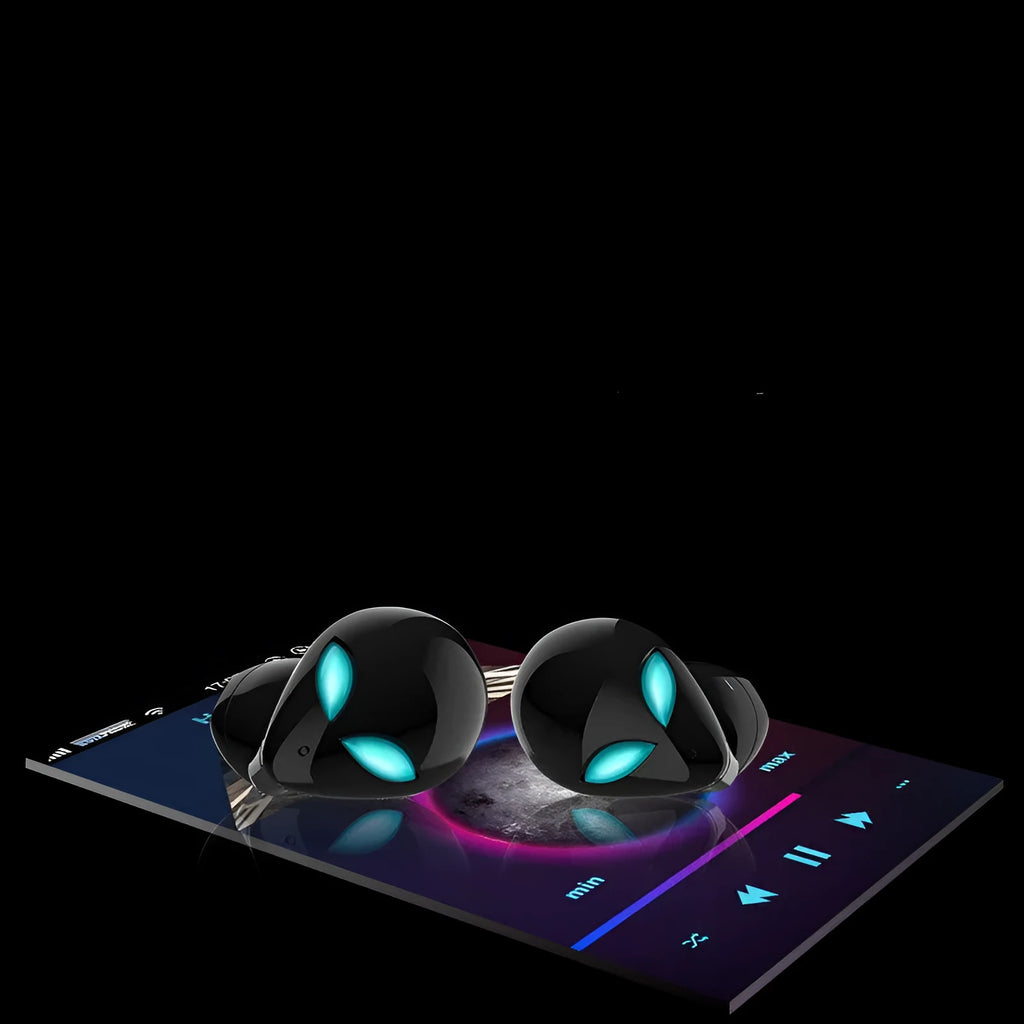 Creative Outer T8 Starman black and white alien design wireless earbuds with LED lights next to charging case.