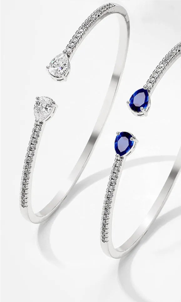 Copper bracelet with multi-zircon inlay in blue or white colour options