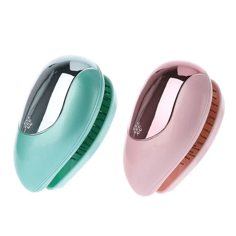 Pink electric sound wave vibration magnetic massage comb with ergonomic handle and negative ion function