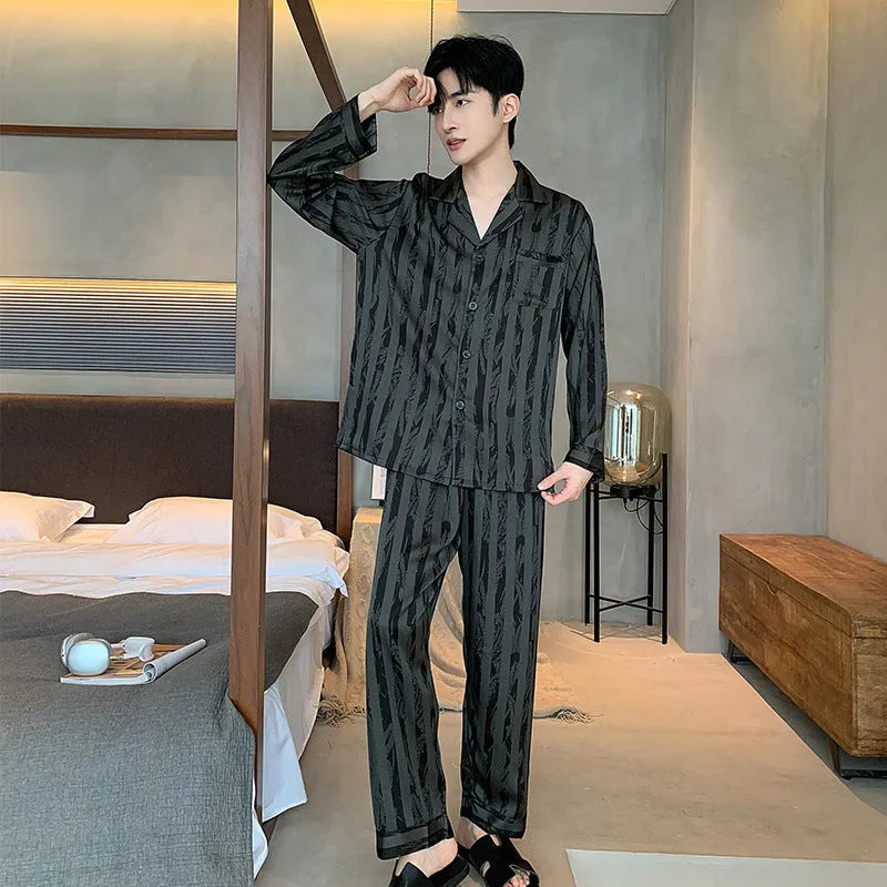 High-grade ice silk men's pyjama set V-neck long sleeve top and thin trousers in black stripes on a neutral background