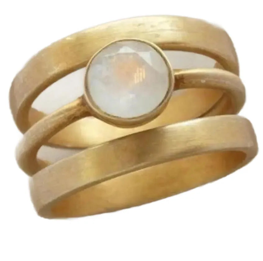 Gold-plated titanium steel ring with a hollow geometric design and micro-inlaid white chalcedony detail.