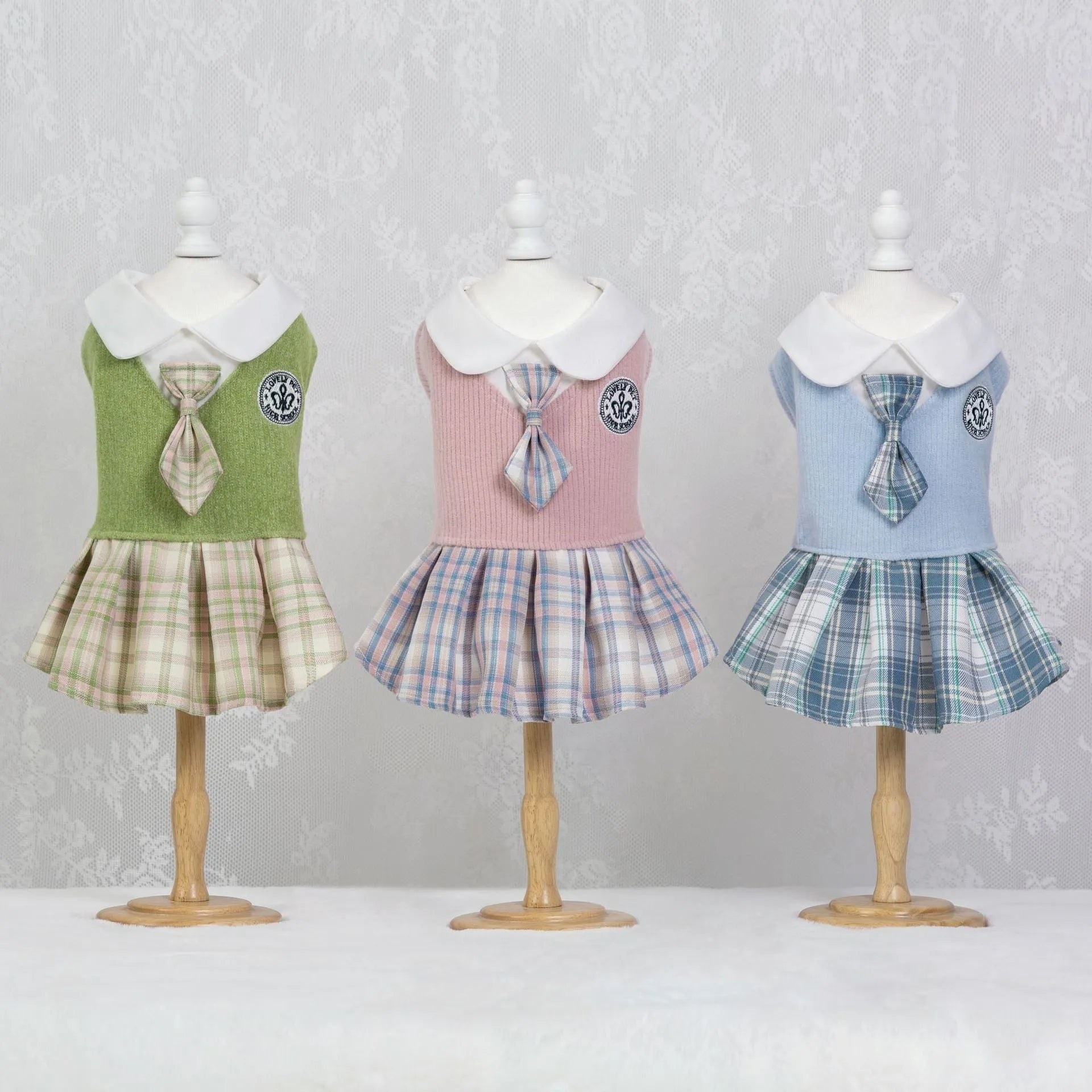 A pink tartan skirt with princess styling for a small dog mannequin.