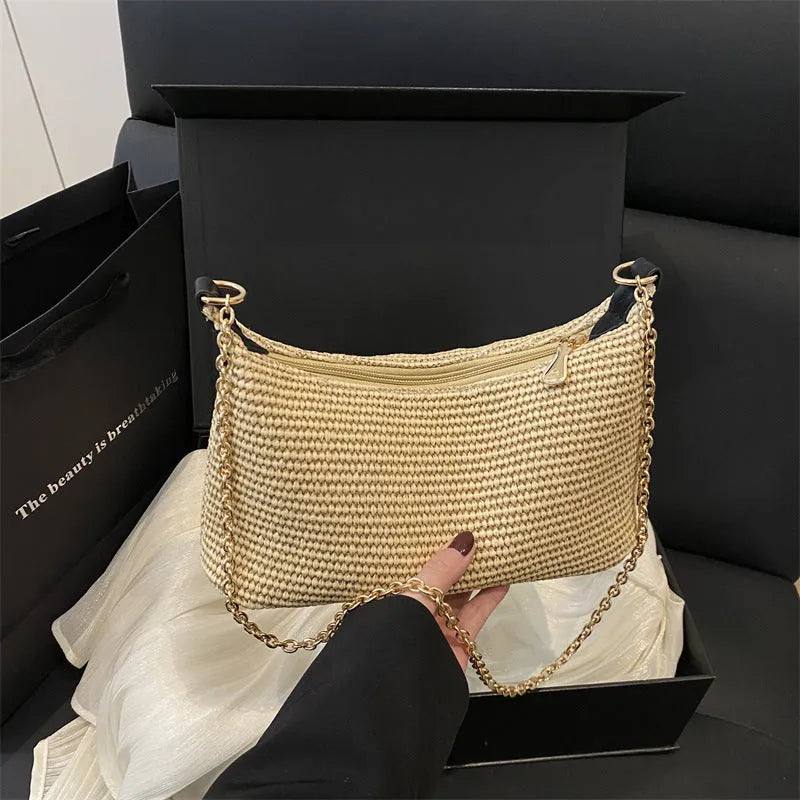 Vacation style straw woven beach shoulder tote bag in horizontal square shape with sandwich pocket