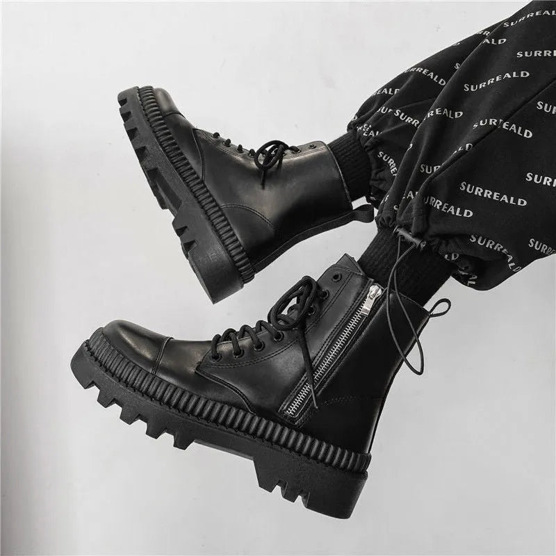 Men's black platform ankle boots with zip, frosted leather upper, and rubber sole.