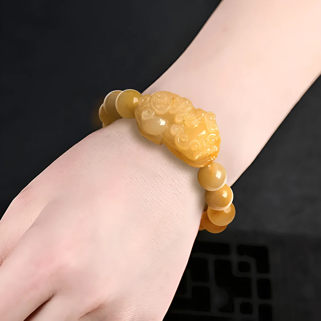 Carved Jinsi Jade money bracelet in golden thread jade colour showing large and small size options.