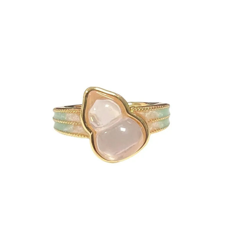 Adjustable copper ring with vintage oil dripping gourd, flower, and bow design and inlaid zircon stones.