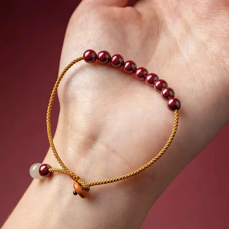 Hand-woven cinnabar geometric bracelet with a raw ore design.