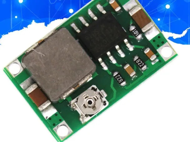 Mini 360 DC-DC buck converter module on green PCB with compact layout showing input and output pads
