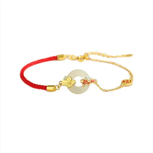 Gold 925 silver koi peace buckle bracelet with red rope on white background