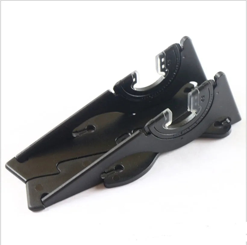 Black plastic card type mobile phone holder with adjustable bracket on desktop