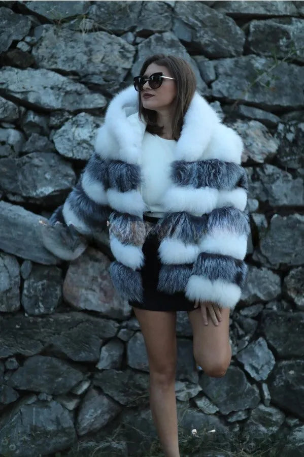 Women's loose faux fur hooded coat in street style, shown in medium length