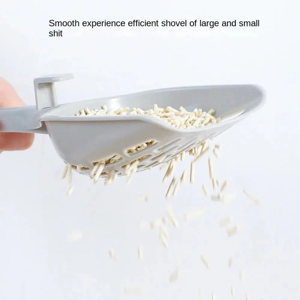 Gray plastic cat litter scoop with matching base for self-cleaning kitten toilet maintenance