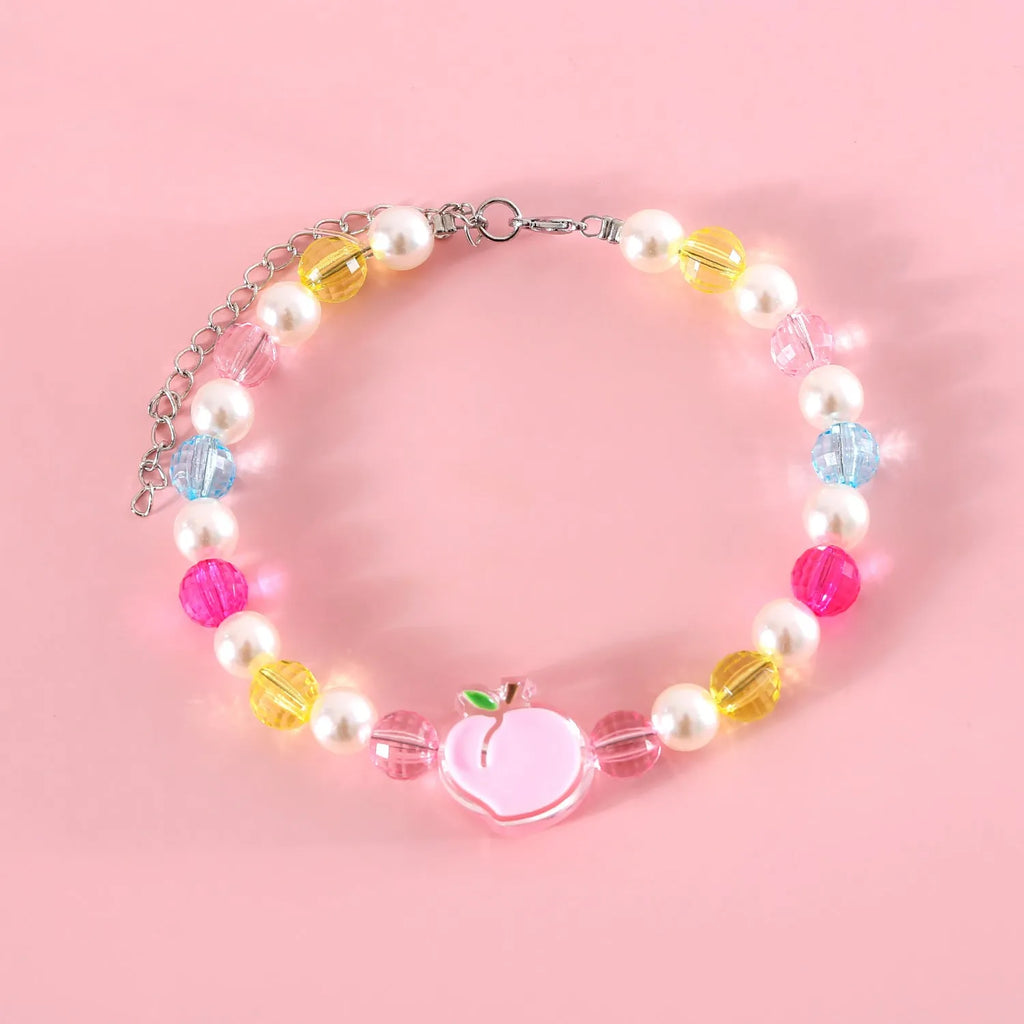 Adjustable plastic cat collar necklace with colourful pearl beads in small flower, rainbow, or peach patterns.