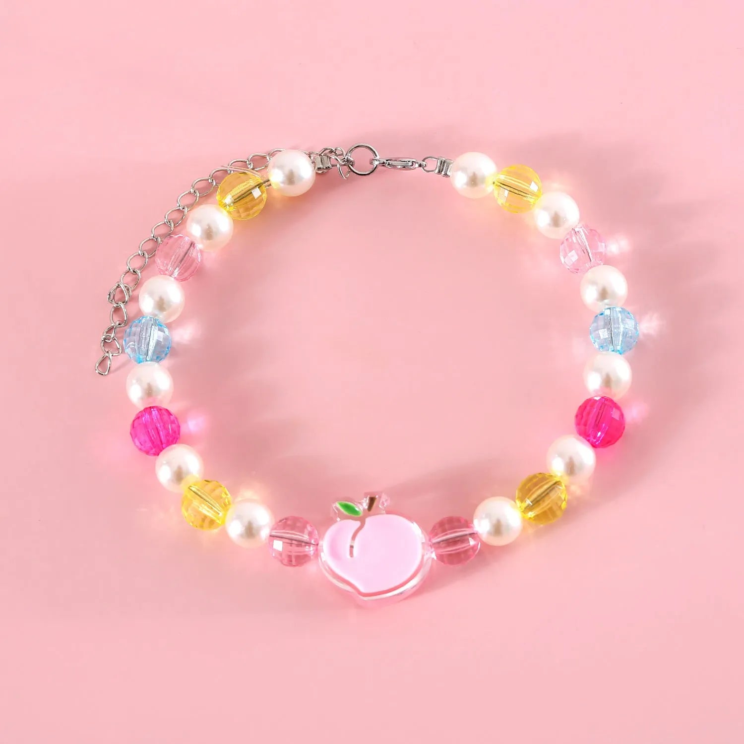 Adjustable plastic cat collar necklace with colourful pearl beads in small flower, rainbow, or peach patterns.