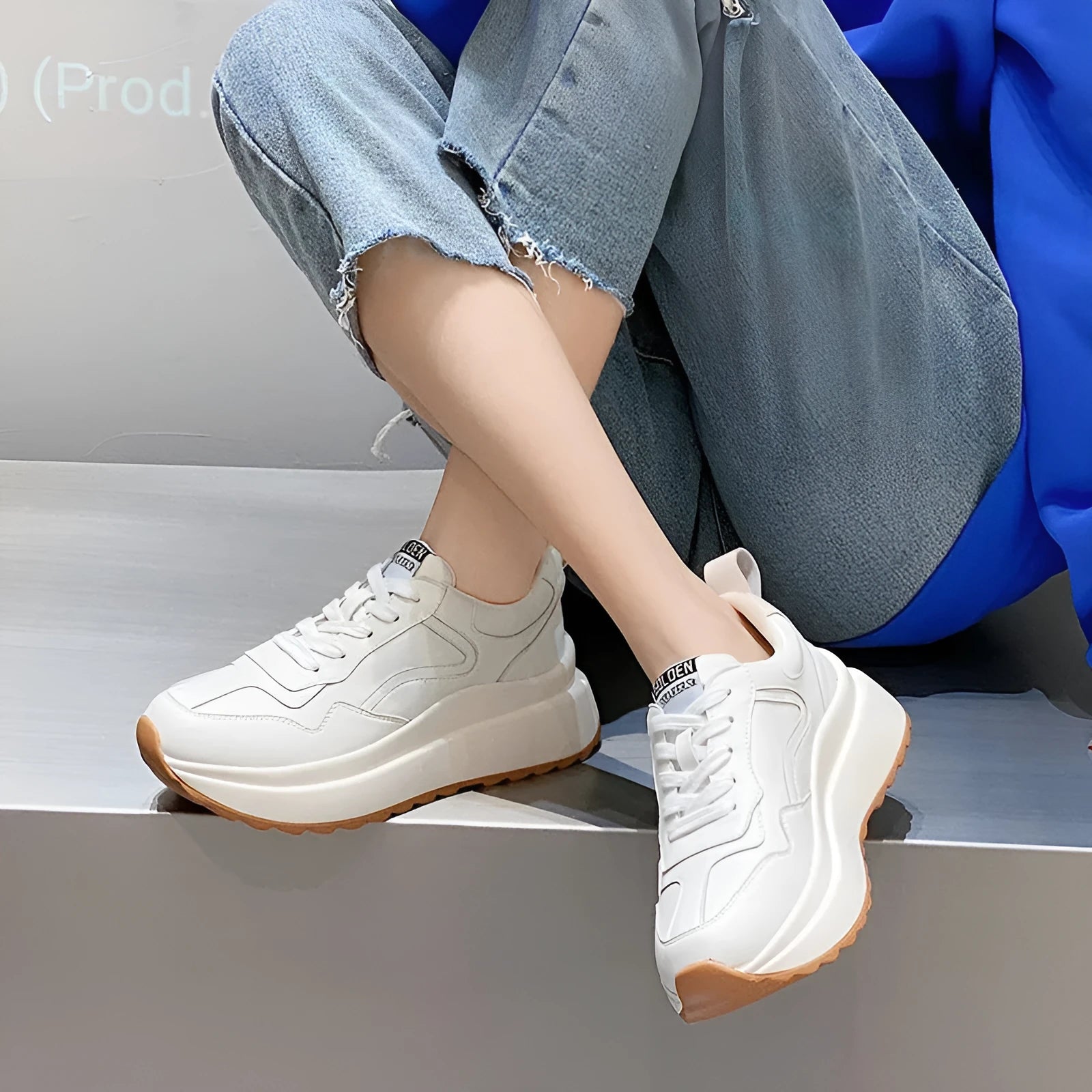 Beige women's low-top leather casual shoes with cross strap and English muffin heel on a white background.