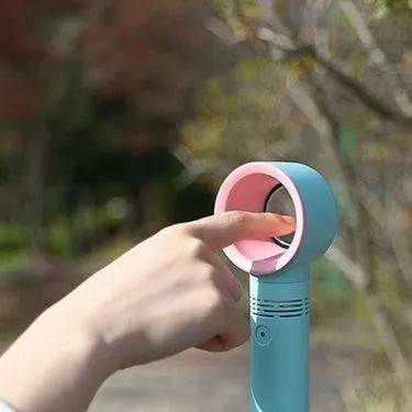 Portable bladeless fan in white with USB charging cable, base, and three speed settings