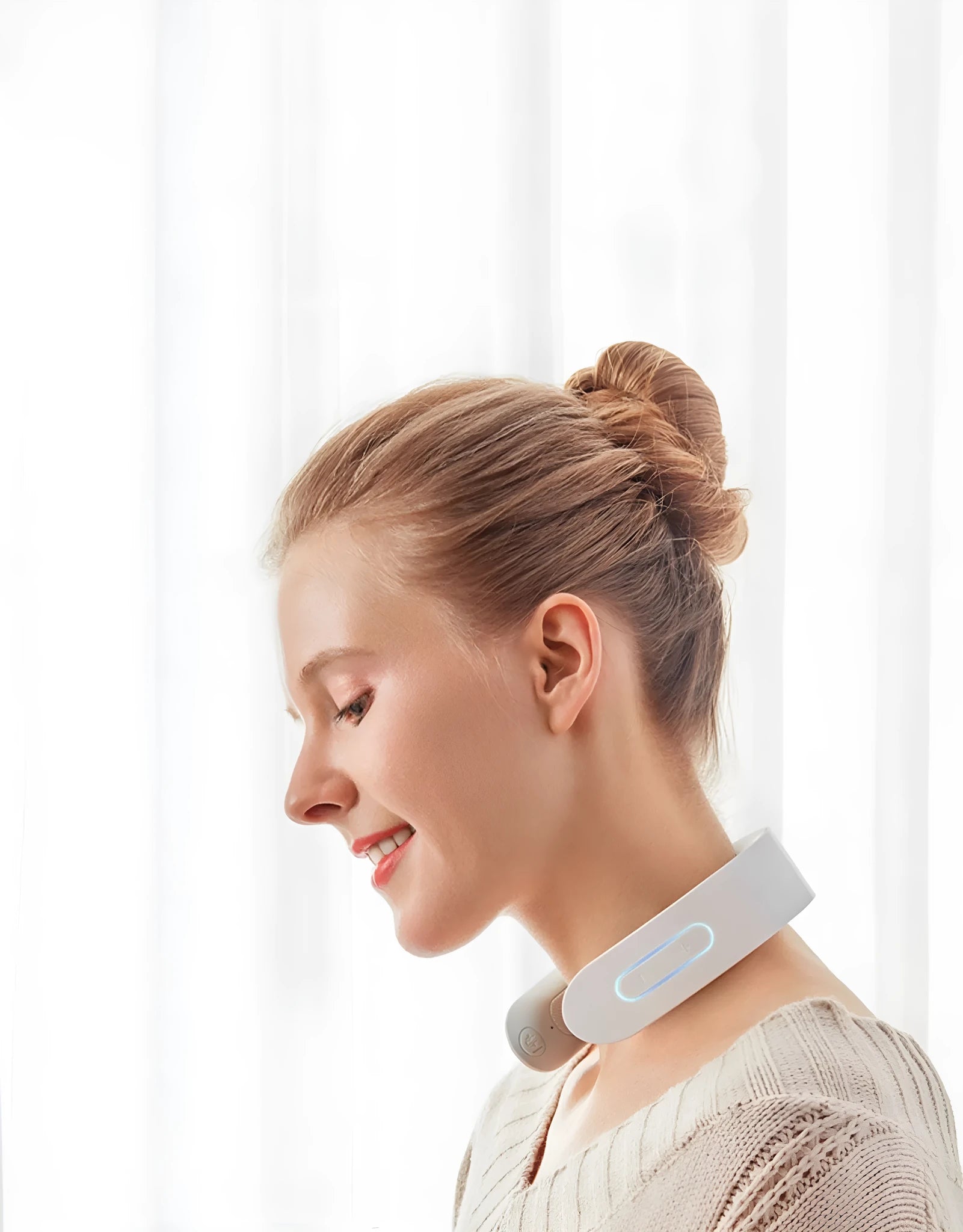 White electric acupressure massager device for back neck and shoulder pain relief with heat therapy.