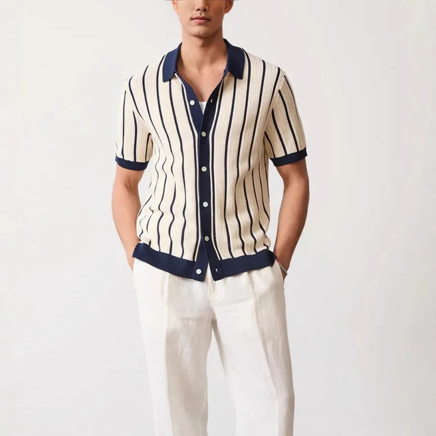 Men's white asymmetric short sleeve knitted top with a lapel, shown on a model.