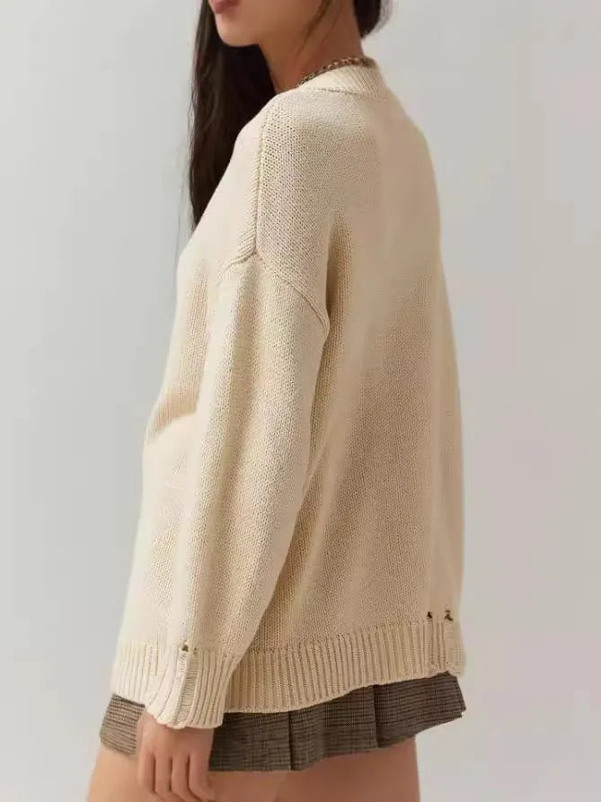 Women's beige loose-fitting acrylic sweater with round neck and long sleeves