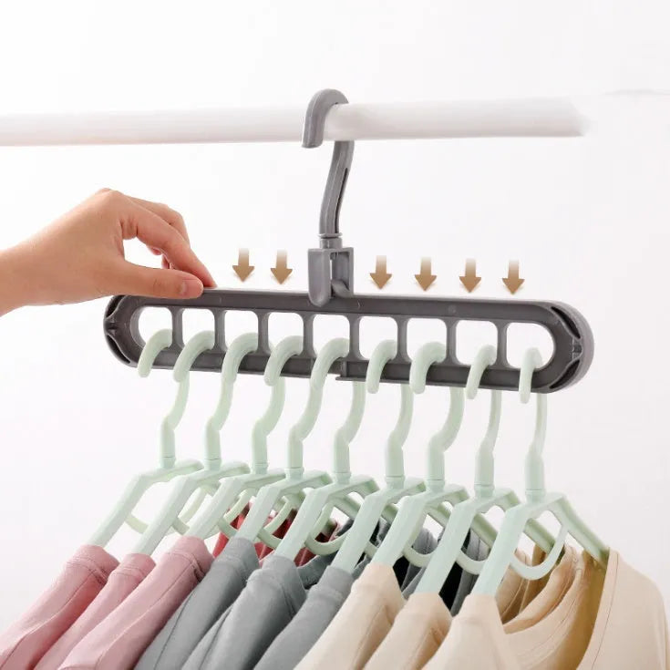 Plastic clothes hanger with 360° rotating hook, 33 cm long, in green colour on white background