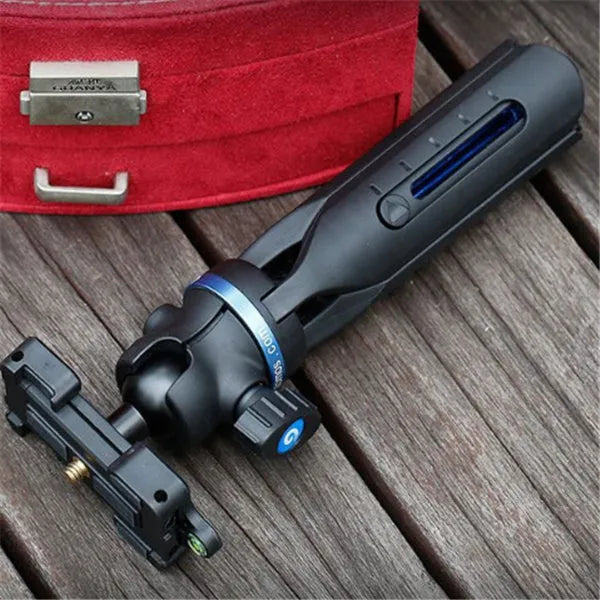 Black desktop phone tripod stand compatible with iPhone models on a desk