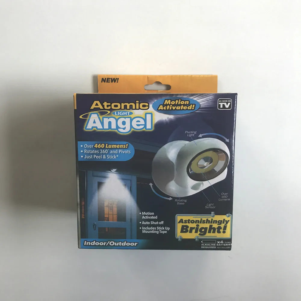 White Atomic Angel induction lamp on surface showing compact 13.3 cm height and ABS plastic construction.