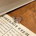 Copper women's ring with butterfly design, showing dripping oil finish surface texture