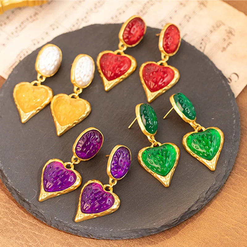 Oval love heart stud earrings with pleated texture in purple, red, green, and yellow-white colours