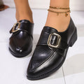 Women's leather-look slip-on shoes with decorative bow buckle detail and pointed toe
