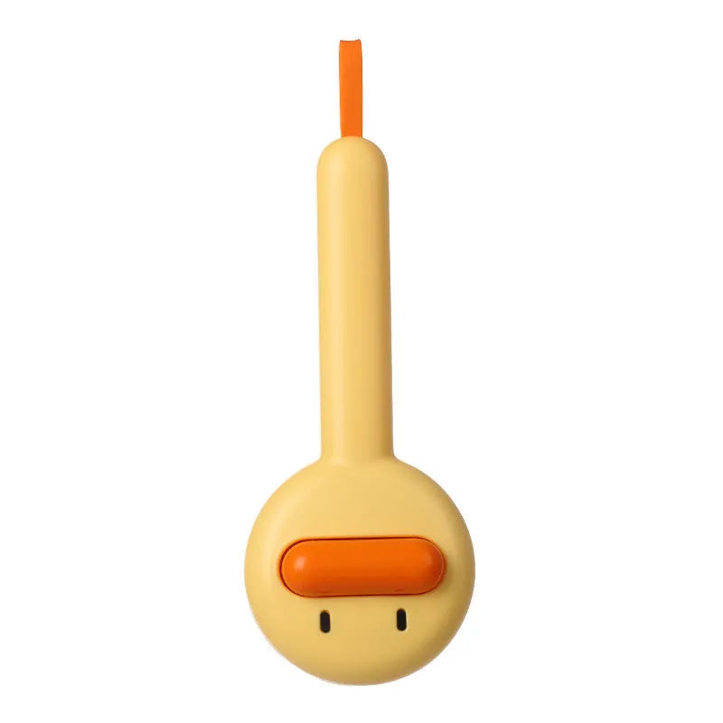 Small yellow duck-shaped pet comb for cat and dog grooming with needle teeth