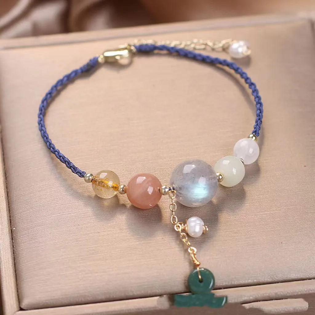 Hand-woven peace buckle bracelet with crystal and sequin details in red, green, and blue colour options for women