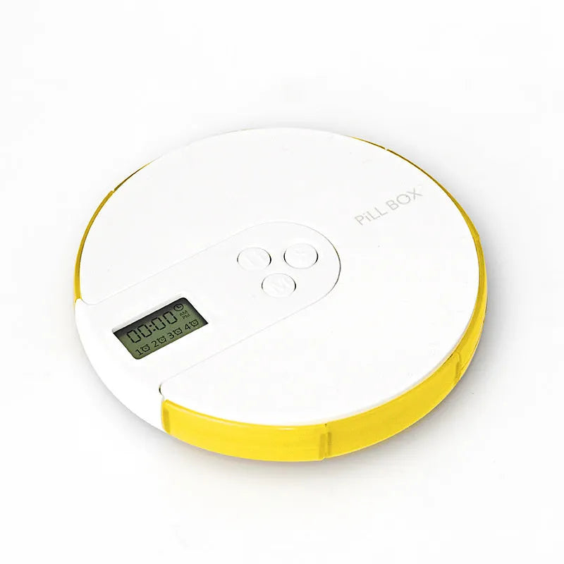 Seven compartment alarm clock pill dispenser showing medication compartments and display