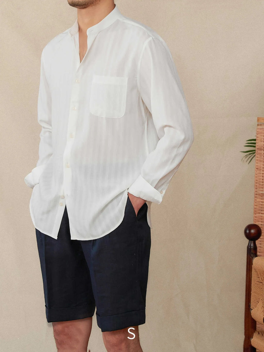 Loose fit seersucker striped long sleeve shirt with baseball collar in blue colour, front view on white background