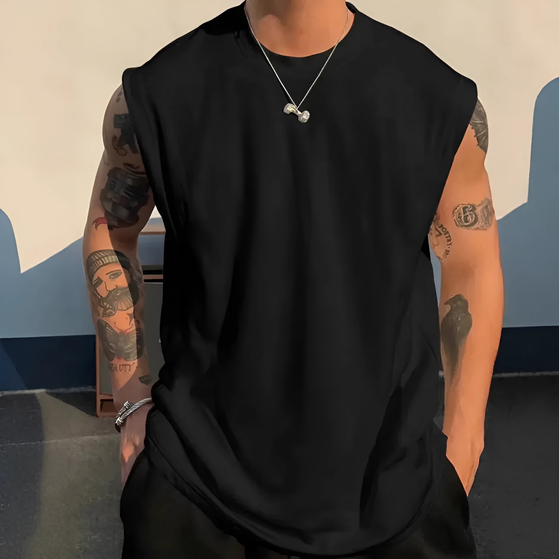 Men's loose solid colour cotton sleeveless tank top on a hanger