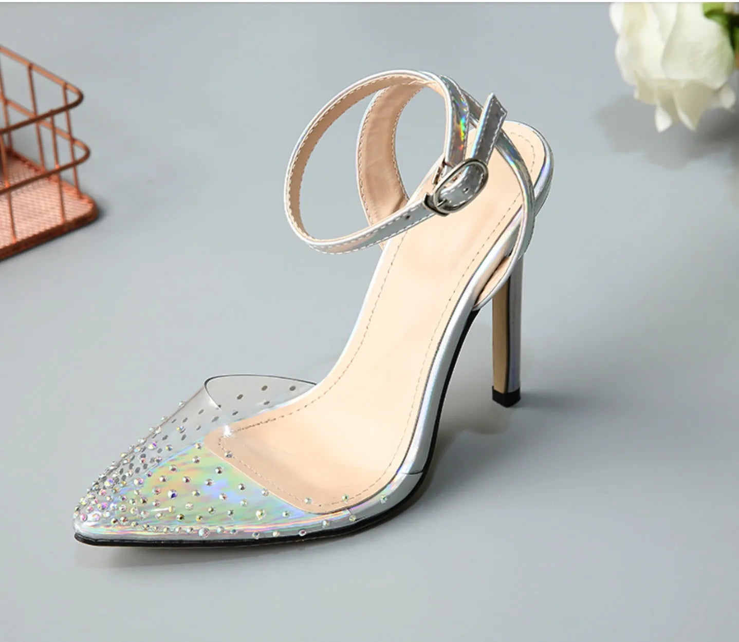 Women's pointed toe diamond sandals with a stiletto heel and PVC upper.