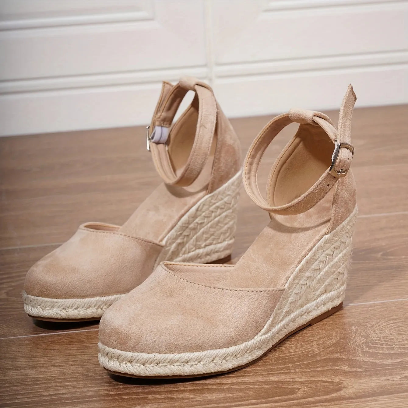 Women's apricot suede Roman style wedge sandals with buckle closure and rubber sole