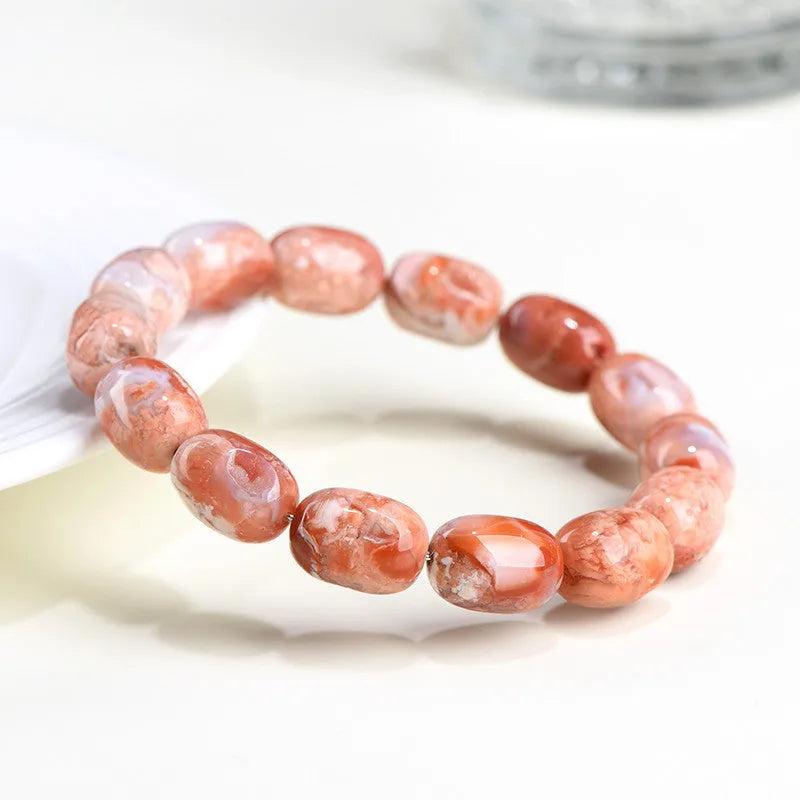Natural cherry blossom agate bracelet with 10x14mm barrel beads and Ruyi geometric design elements