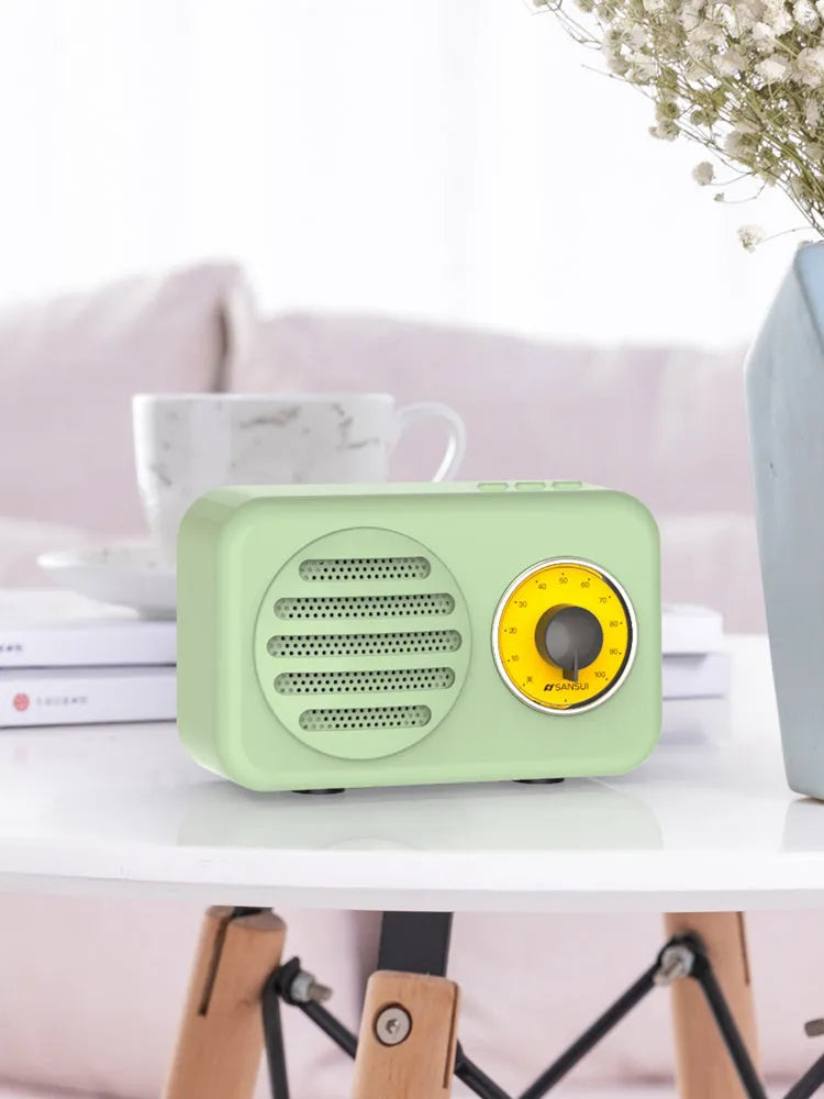 T1 portable Bluetooth speaker in wood grain pink with vintage finish, compact size, and FM radio support