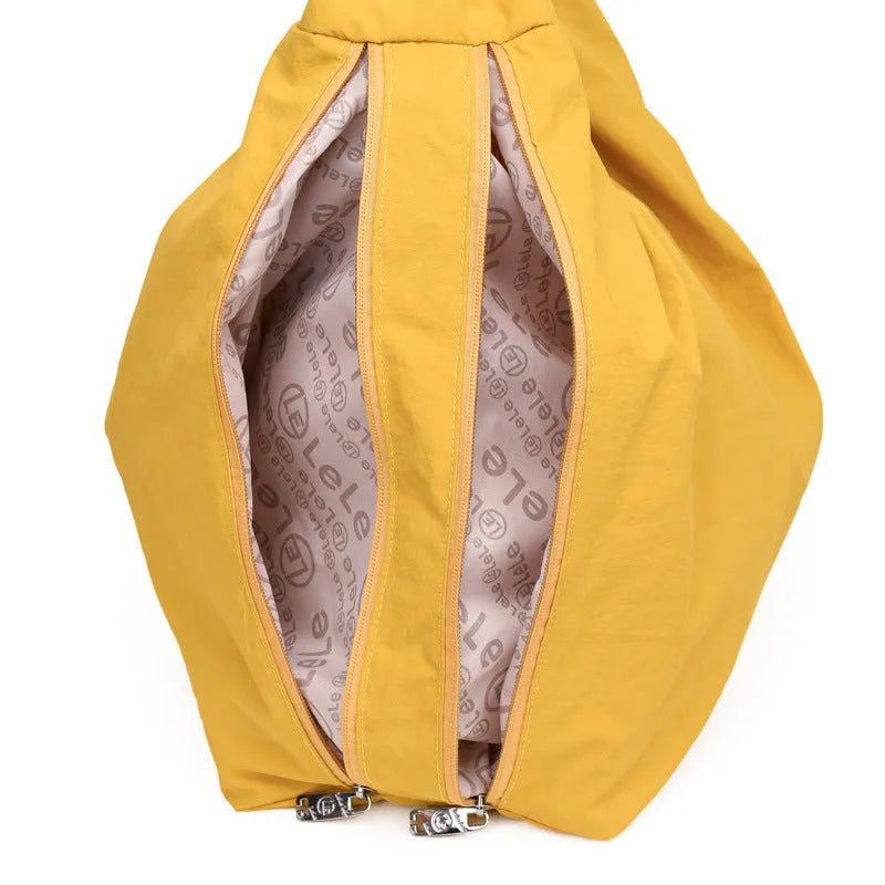 Soft nylon heart-shaped underarm bag for women in black, blue, khaki, or yellow.
